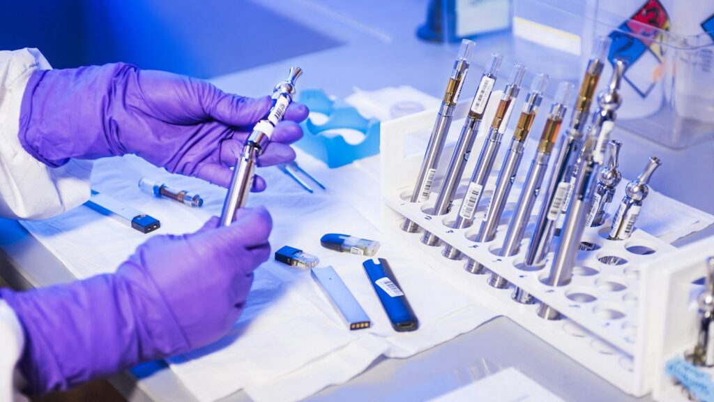 Blood sample tubes in a laboratory rack, ready for follow-up HIV testing