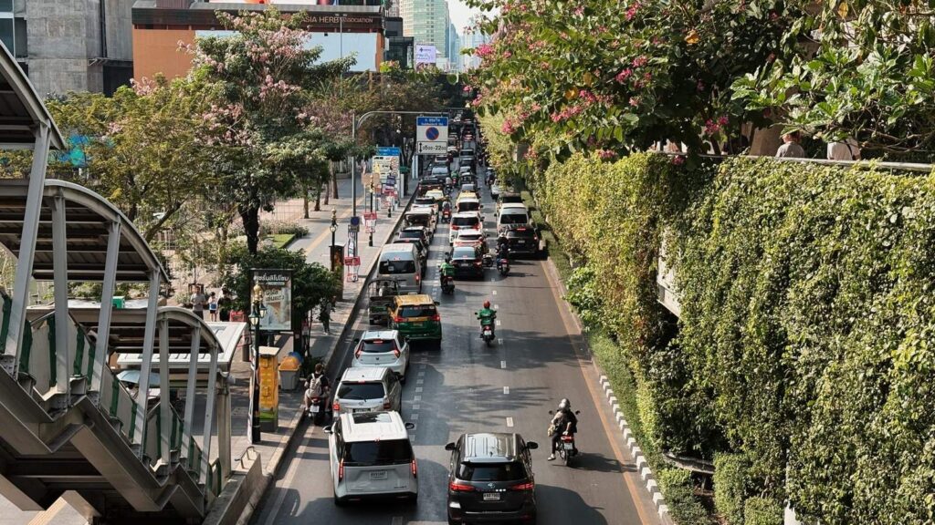 Busy Bangkok street under the BTS Skytrain, the kind of area around our clinic