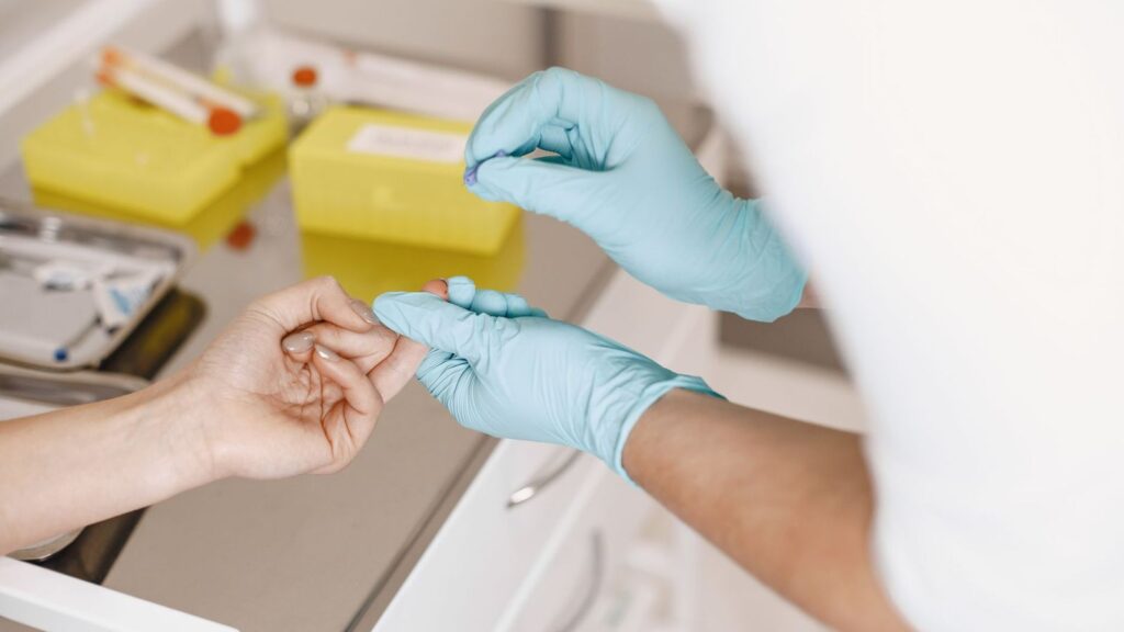 Clinician preparing a rapid HIV test in a clinic after a possible exposure