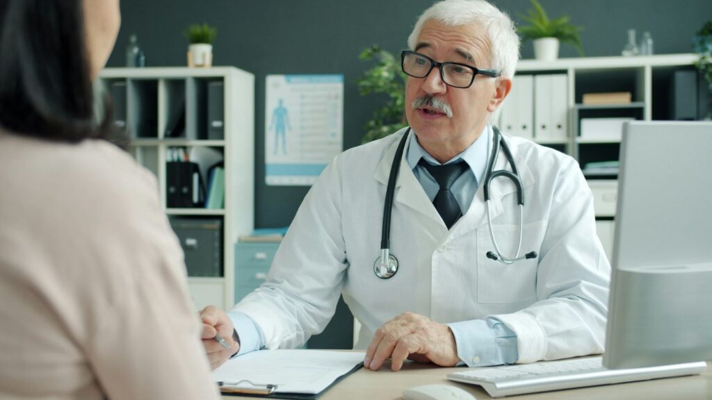 Doctor listening to a patient in a consultation room about HIV prevention options