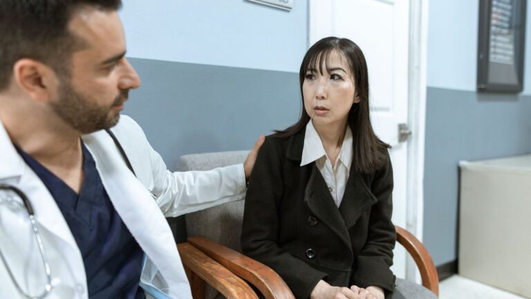 Doctor and patient talking calmly in a consultation room about HIV risk and oral sex