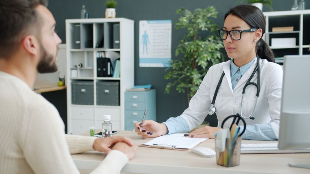Doctor and patient talking in a private clinic room during a PEP consultation in Bangkok