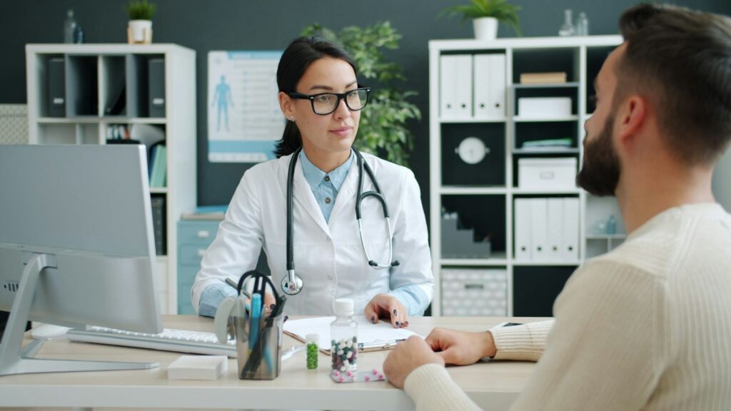 Doctor talking with a patient in a private consultation room before an HIV test