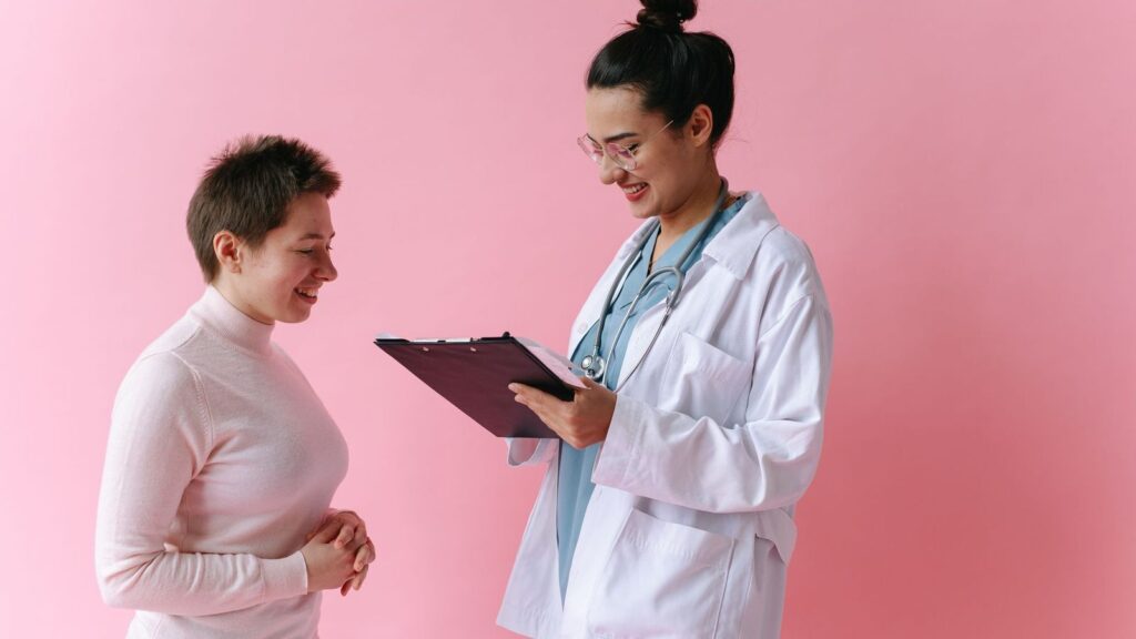 Friendly doctor answering a patient's questions about PEP in a private consultation