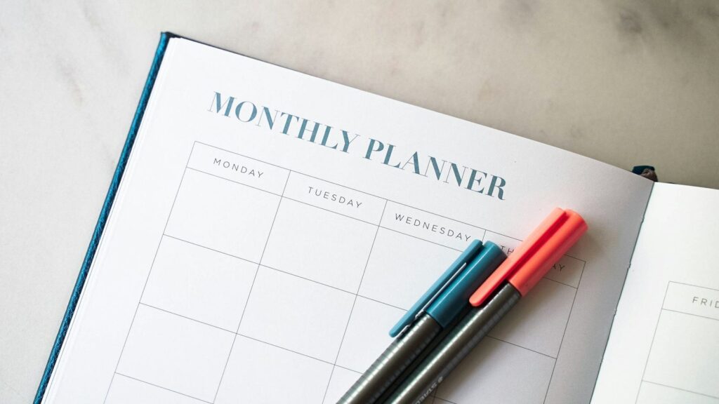 Hand marking follow-up HIV test dates on a calendar after starting PEP