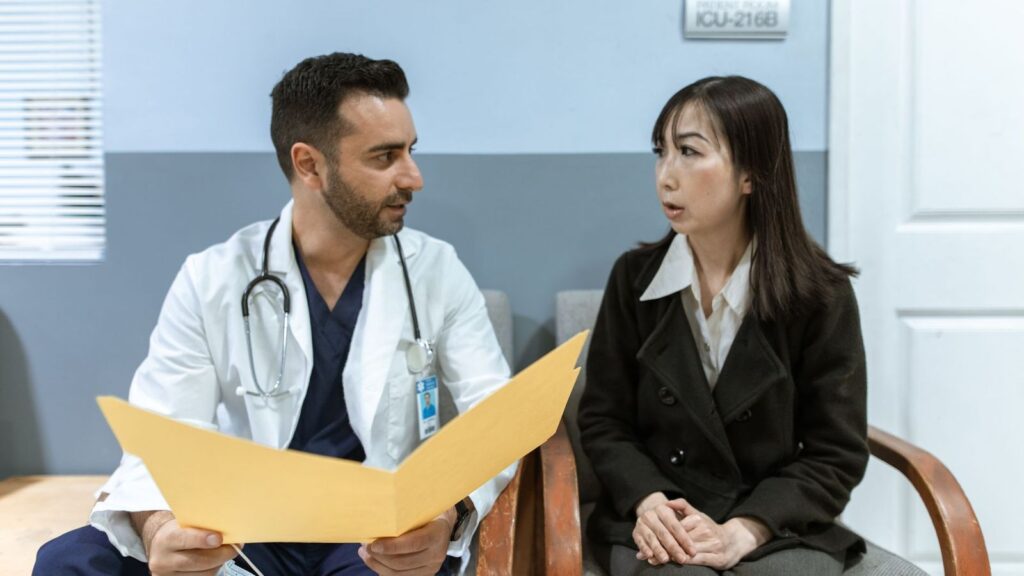 Doctor reviewing notes with a patient during a private PEP consultation