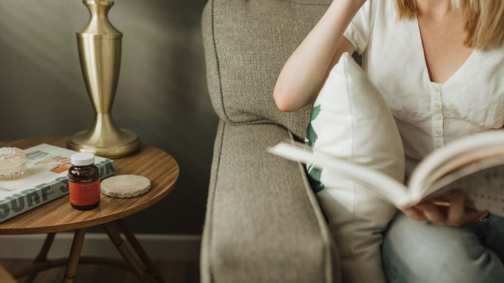Person reading a medicine information leaflet at home to check how to take PEP