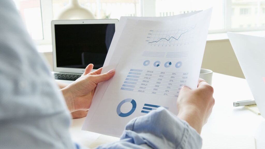 Printed research papers and graphs on a desk, the kind of evidence behind PEP failure rates