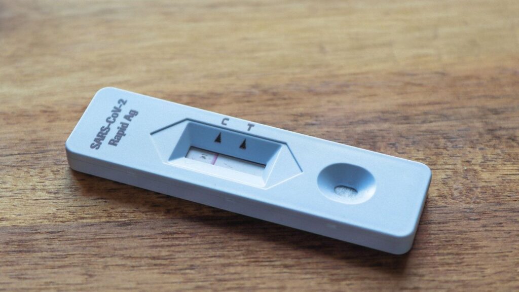 Rapid test cassette on a clinic table, part of HIV testing after a possible exposure