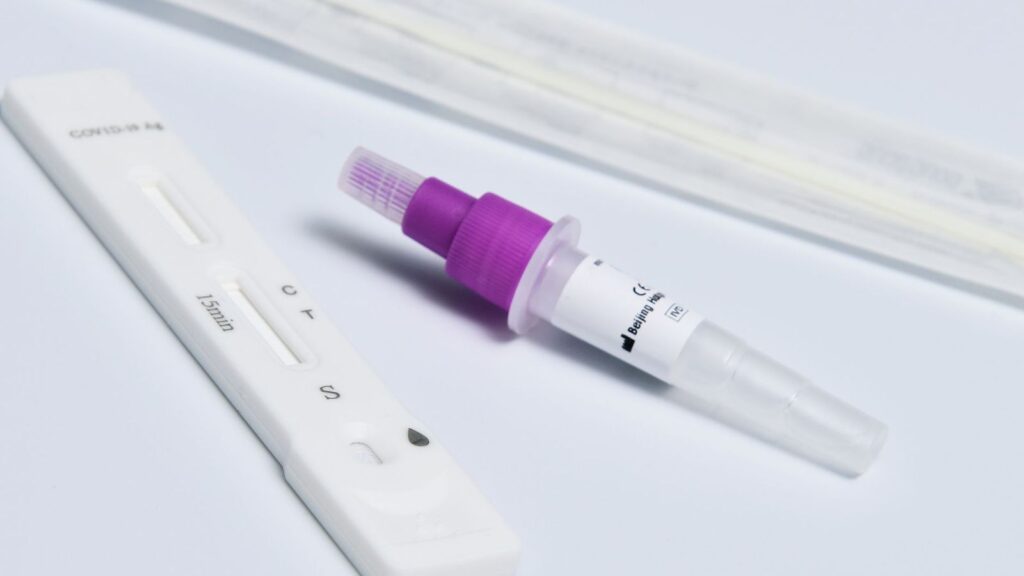 Rapid test cassette on a table, similar to a rapid 4th-generation HIV test