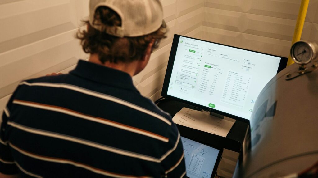 Researcher reviewing data charts on a computer screen, representing studies on PEP outcomes