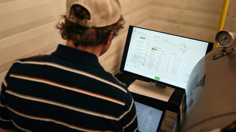 Researcher reviewing data charts on a computer screen, representing studies on PEP outcomes
