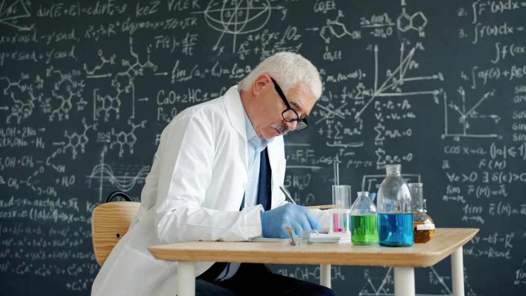 Researcher reviewing study papers, reflecting how PEP evidence is gathered