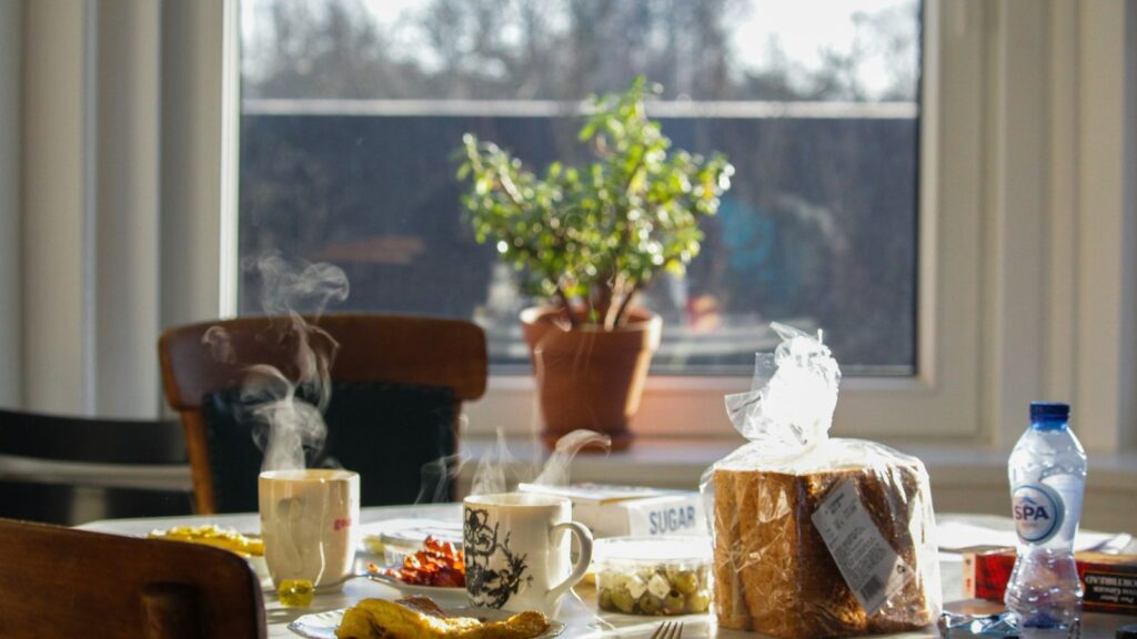 Smartphone alarm on a breakfast table, a simple daily reminder for PEP tablets