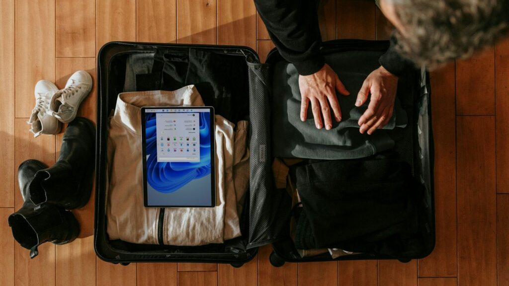Suitcase being packed for a trip, with space kept for the PEP supply in hand luggage