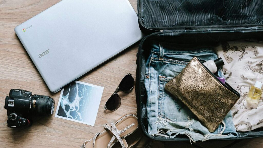 Traveller packing a suitcase, planning a PrEP supply and check-ups around a trip
