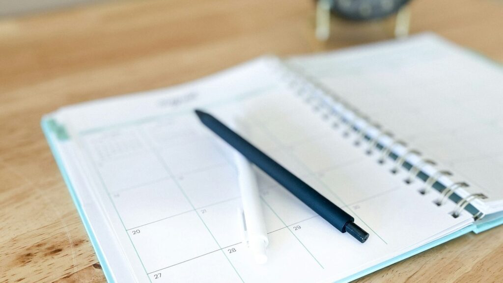 Wall calendar with dates marked in pen, a way to count the days while PrEP builds up